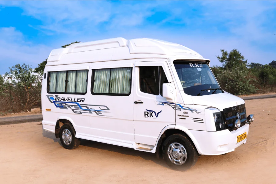 White 9 seater tempo traveller parked for group travel in Delhi